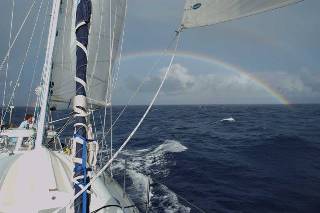 sailing away from a rainbow